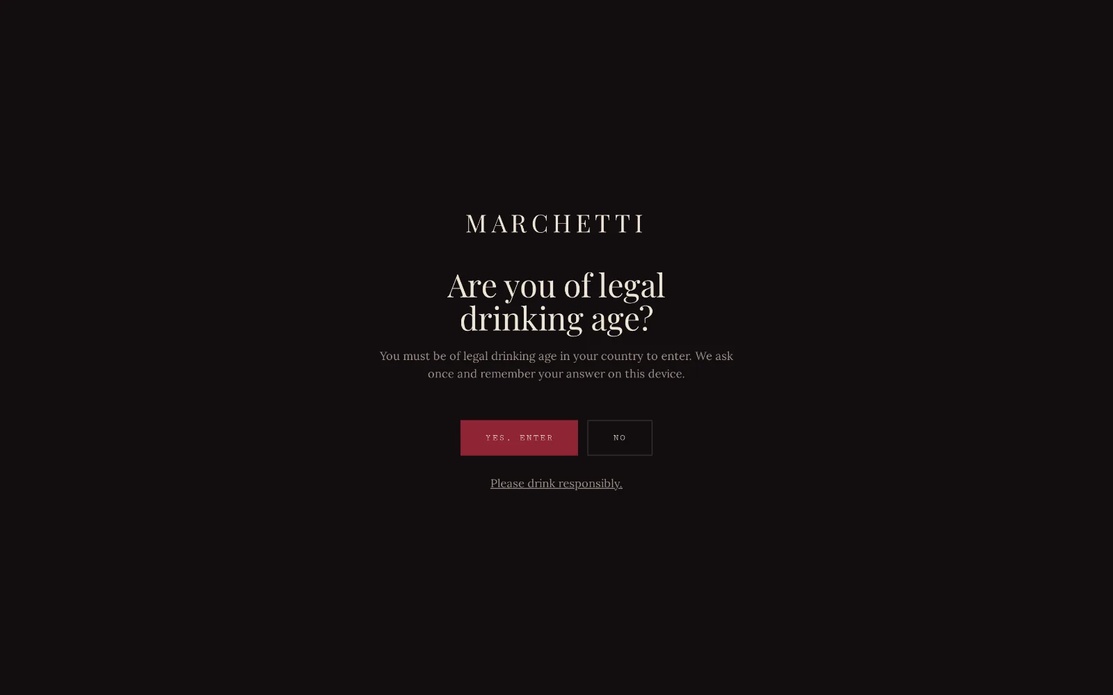 Desktop capture of the Marchetti Cellar design: a near-black age-verification screen with a letter-spaced serif wordmark, the question “Are you of legal drinking age?”, and an oxblood confirm button.